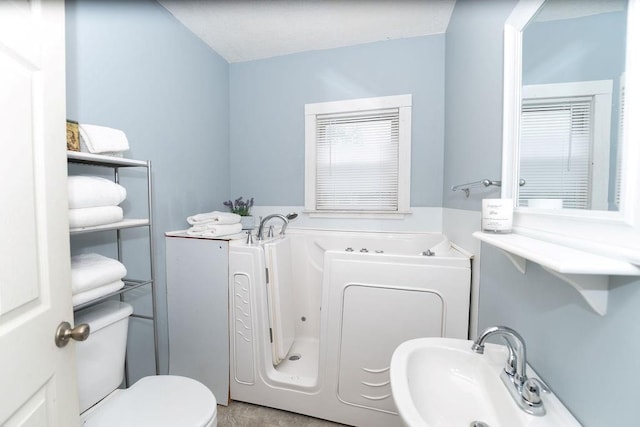 103 N Missouri St, Adrian, MO 64720 - bathroom with a bath and toilet