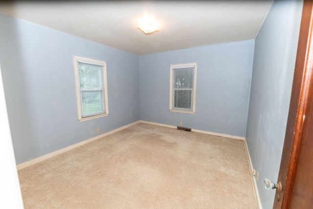 103 N Missouri St, Adrian, MO 64720 - empty room featuring carpet floors and baseboards