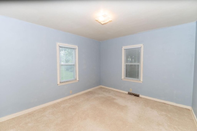 103 N Missouri St, Adrian, MO 64720 - spare room featuring carpet flooring and baseboards