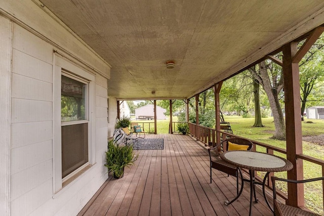 103 N Missouri St, Adrian, MO 64720 - wooden terrace featuring a yard