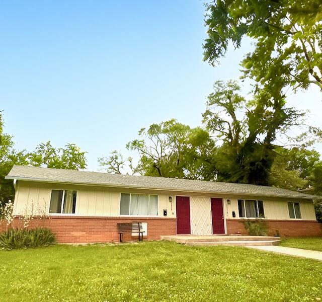 10818-10820 W 57th St, Shawnee, KS 66203 - ranch-style house with brick siding and a front yard