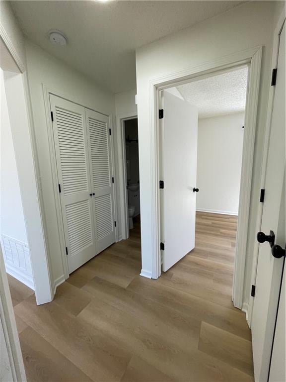 10818-10820 W 57th St, Shawnee, KS 66203 - corridor with light wood-style floors and baseboards