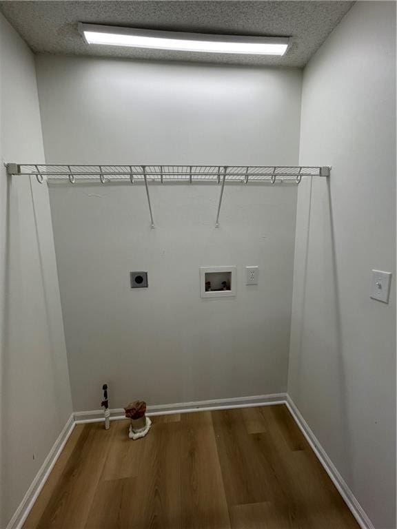 10818-10820 W 57th St, Shawnee, KS 66203 - washroom featuring electric dryer hookup, wood finished floors, washer hookup, and a textured ceiling