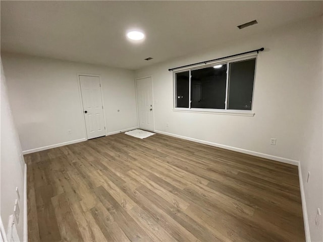 10818-10820 W 57th St, Shawnee, KS 66203 - empty room featuring wood finished floors and baseboards
