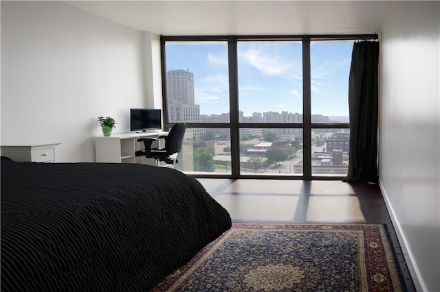 600 Admiral Blvd Unit 1505, Kansas City, MO 64106 - bedroom with wood finished floors and expansive windows