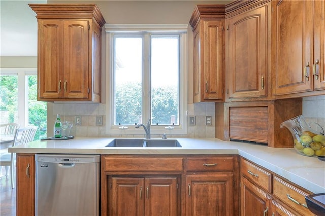 16042 Overbrook Ln, Stilwell, KS 66085 - kitchen with dishwasher, light countertops, and brown cabinetry