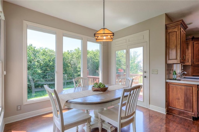 16042 Overbrook Ln, Stilwell, KS 66085 - dining area with baseboards and dark wood-style flooring