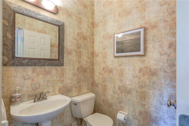 16042 Overbrook Ln, Stilwell, KS 66085 - half bath with toilet and a sink