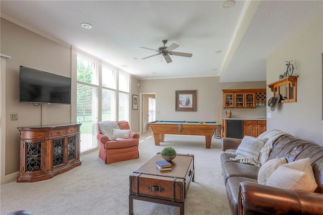 16042 Overbrook Ln, Stilwell, KS 66085 - carpeted living room with billiards, ceiling fan, and crown molding