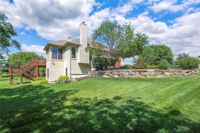 16042 Overbrook Ln, Stilwell, KS 66085 - rear view of house featuring stairway, a chimney, a wooden deck, and a yard