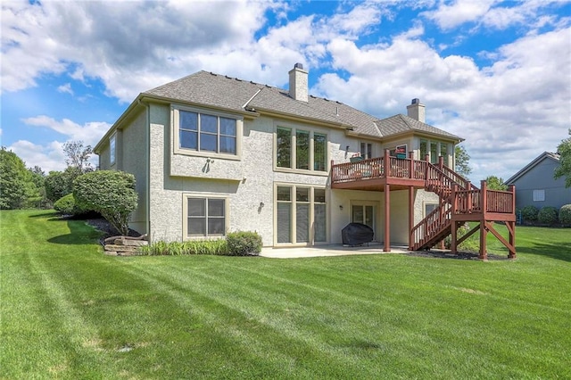 16042 Overbrook Ln, Stilwell, KS 66085 - back of property featuring a chimney, stairs, a patio, a wooden deck, and a yard
