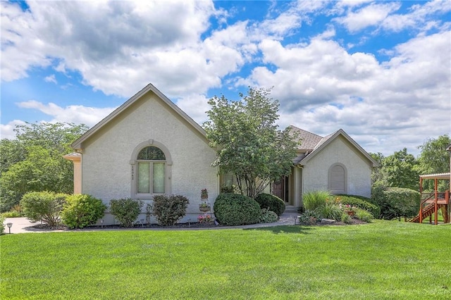 16042 Overbrook Ln, Stilwell, KS 66085 - view of front facade with a front lawn and stucco siding