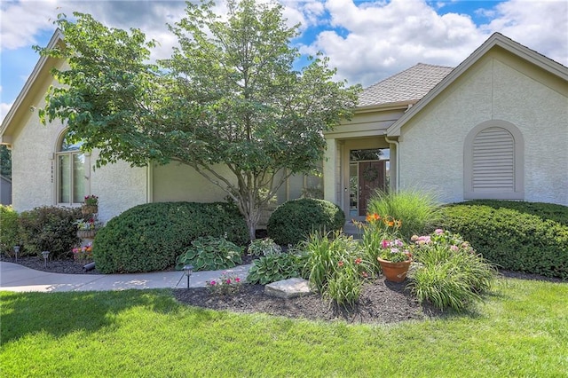 16042 Overbrook Ln, Stilwell, KS 66085 - view of front of property featuring stucco siding and a front lawn