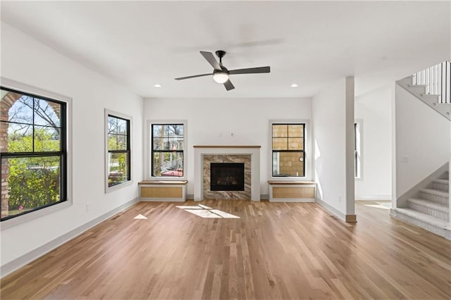 6000 El Monte St, Fairway, KS 66205 - unfurnished living room with stairway, light wood finished floors, ceiling fan, a fireplace, and recessed lighting