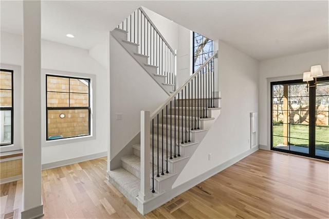 6000 El Monte St, Fairway, KS 66205 - stairway featuring healthy amount of natural light and wood finished floors