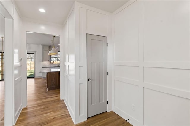 6000 El Monte St, Fairway, KS 66205 - hallway featuring light wood-type flooring, recessed lighting, and a decorative wall