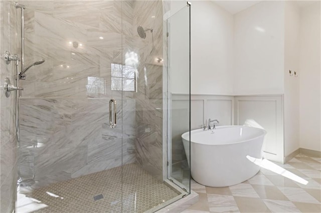 6000 El Monte St, Fairway, KS 66205 - full bath featuring a freestanding tub, a shower stall, a decorative wall, and wainscoting
