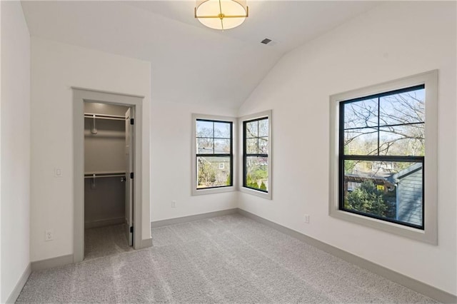 6000 El Monte St, Fairway, KS 66205 - unfurnished bedroom with carpet floors, a walk in closet, lofted ceiling, and a closet