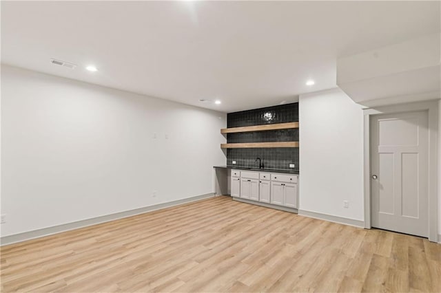 6000 El Monte St, Fairway, KS 66205 - indoor bar with light wood-style floors, decorative backsplash, and recessed lighting