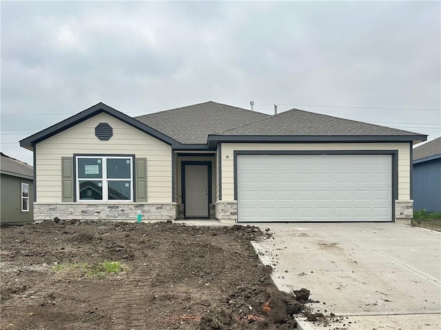 599 W Lanesfield St, Gardner, KS 66030 - ranch-style home featuring stone siding, driveway, a garage, and a shingled roof