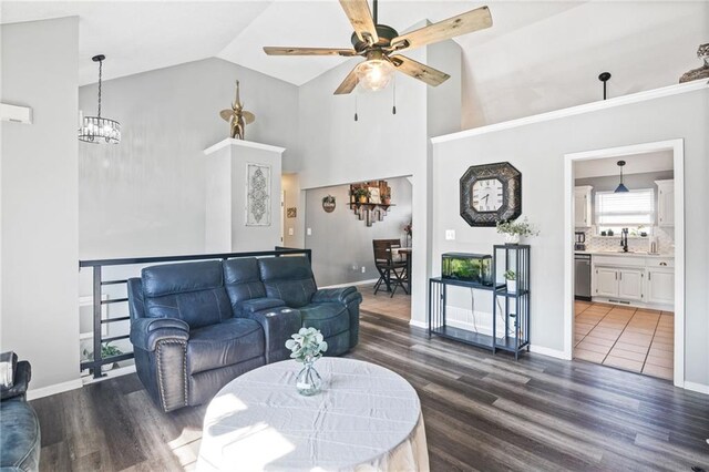 4416 Broadway Ter, Leavenworth, KS 66048 - living area featuring a ceiling fan, dark wood-style floors, high vaulted ceiling, and a chandelier