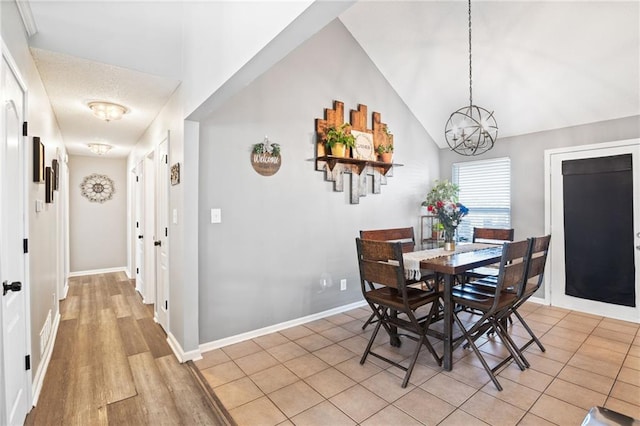 4416 Broadway Ter, Leavenworth, KS 66048 - dining area with a chandelier and light wood-style flooring