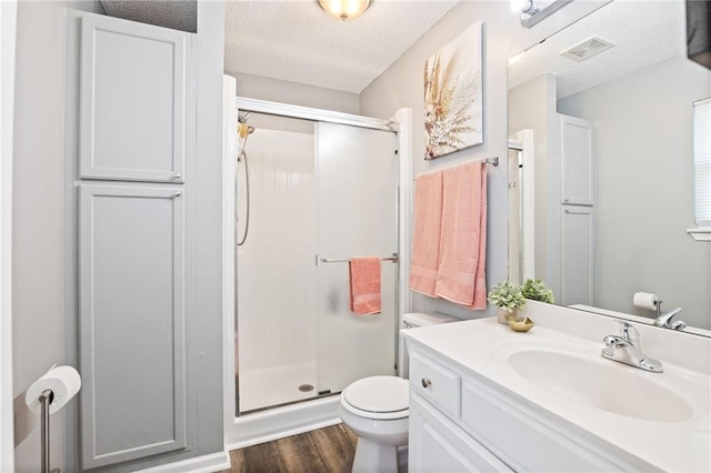 4416 Broadway Ter, Leavenworth, KS 66048 - full bath with a stall shower, wood finished floors, vanity, and a textured ceiling