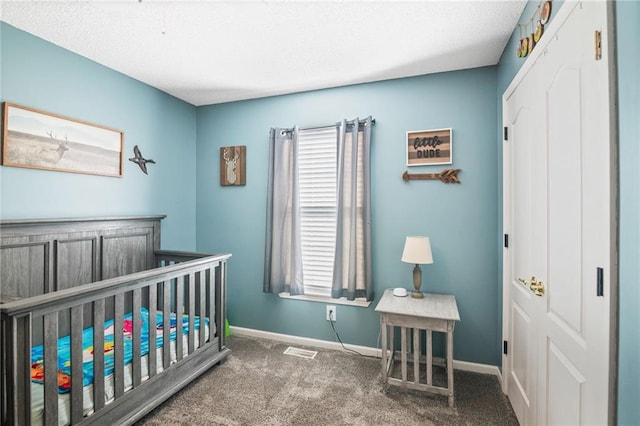 4416 Broadway Ter, Leavenworth, KS 66048 - bedroom featuring multiple windows, carpet floors, a nursery area, and a textured ceiling
