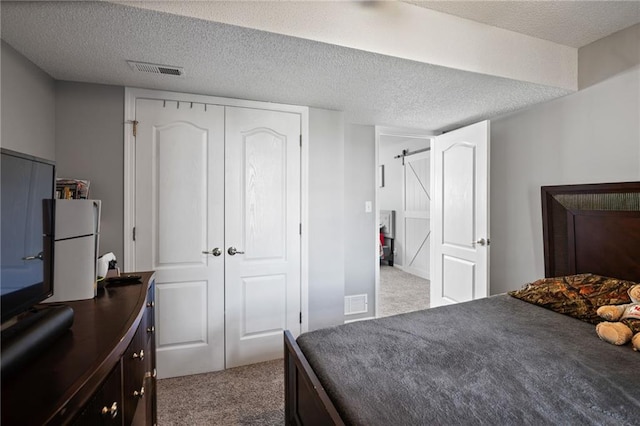 4416 Broadway Ter, Leavenworth, KS 66048 - bedroom with light colored carpet, a closet, and a textured ceiling