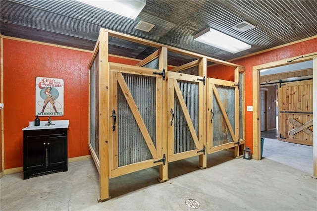204 E Casey Rd, Lone Jack, MO 64070 - misc room featuring unfinished concrete floors and a barn door