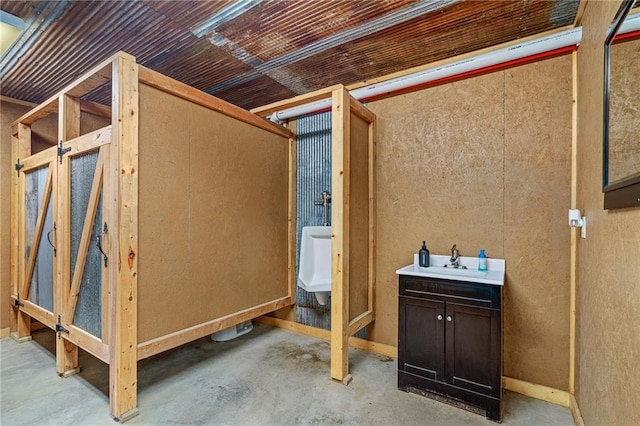 204 E Casey Rd, Lone Jack, MO 64070 - bathroom with concrete flooring and vanity