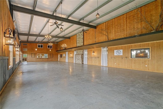 204 E Casey Rd, Lone Jack, MO 64070 - garage featuring ceiling fan and wood walls