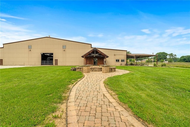 204 E Casey Rd, Lone Jack, MO 64070 - back of property with a yard and an outbuilding