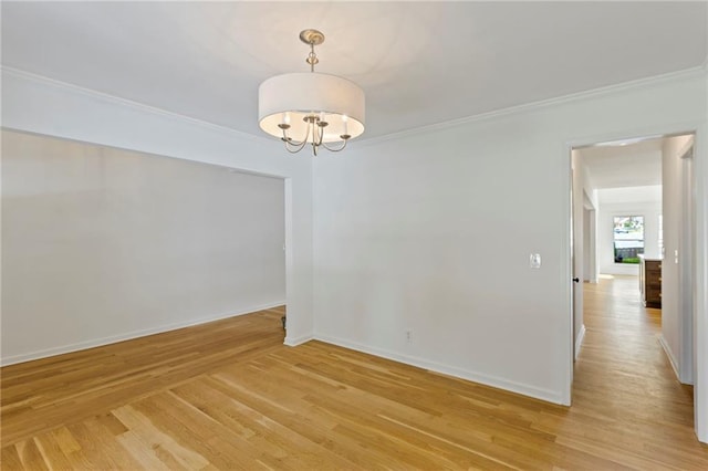 10136 Barton St, Overland Park, KS 66214 - empty room with light wood-style floors, a chandelier, and ornamental molding