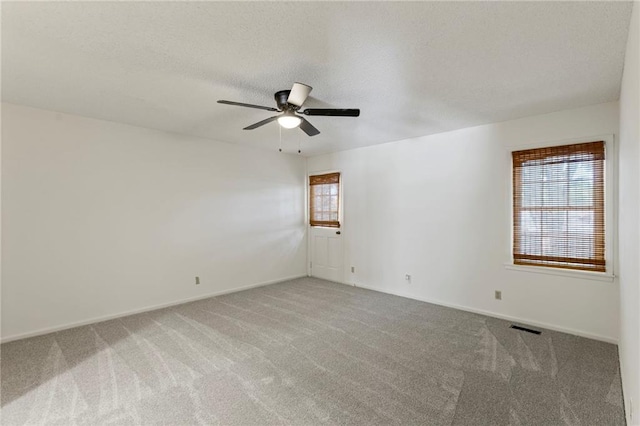 10136 Barton St, Overland Park, KS 66214 - empty room featuring carpet flooring, ceiling fan, and a textured ceiling
