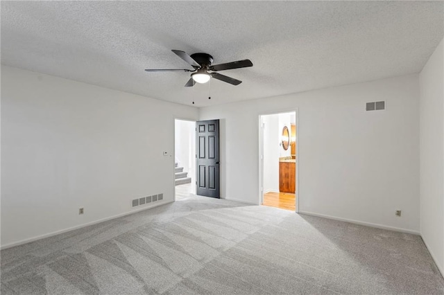 10136 Barton St, Overland Park, KS 66214 - carpeted empty room featuring ceiling fan and a textured ceiling