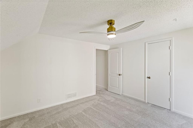 10136 Barton St, Overland Park, KS 66214 - unfurnished bedroom featuring carpet floors, a textured ceiling, and ceiling fan