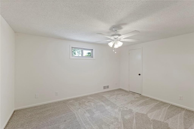 10136 Barton St, Overland Park, KS 66214 - unfurnished room featuring light colored carpet, a ceiling fan, and a textured ceiling