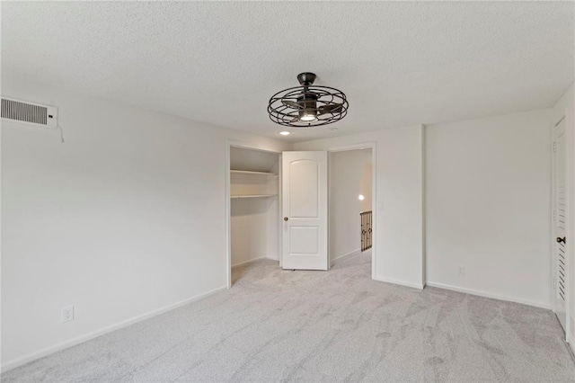 10136 Barton St, Overland Park, KS 66214 - unfurnished bedroom featuring a textured ceiling, carpet, and recessed lighting