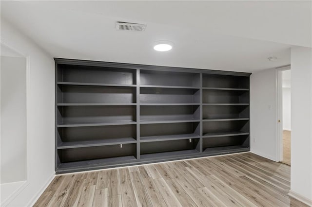 10136 Barton St, Overland Park, KS 66214 - detailed view of wood finished floors and baseboards