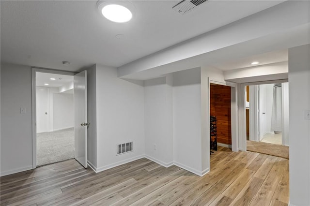 10136 Barton St, Overland Park, KS 66214 - finished basement featuring light wood-style flooring and recessed lighting