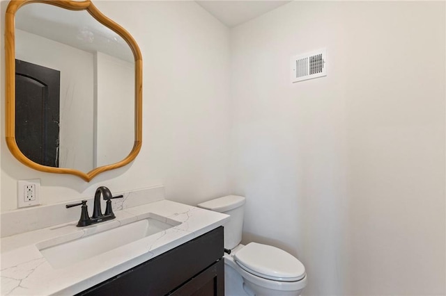 10136 Barton St, Overland Park, KS 66214 - bathroom with toilet and vanity
