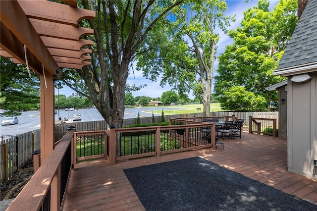 10136 Barton St, Overland Park, KS 66214 - deck with outdoor dining space and a fenced backyard
