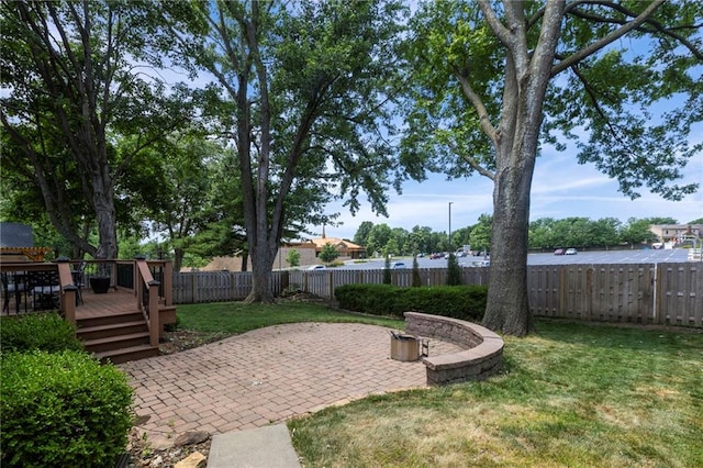 10136 Barton St, Overland Park, KS 66214 - fenced backyard featuring a deck and a patio area