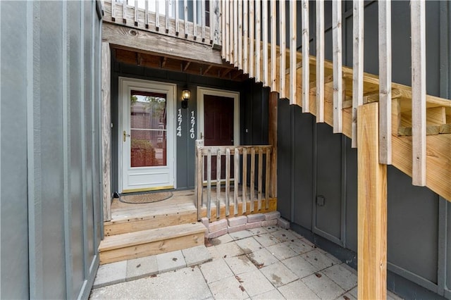 12740 W 110th Ter, Overland Park, KS 66210 - entrance to property with board and batten siding and a balcony