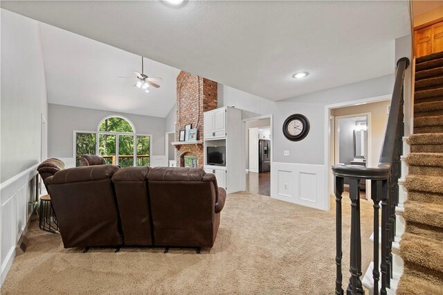 414 N 4th St, Gower, MO 64454 - living room with a decorative wall, light carpet, ceiling fan, a wainscoted wall, and stairway