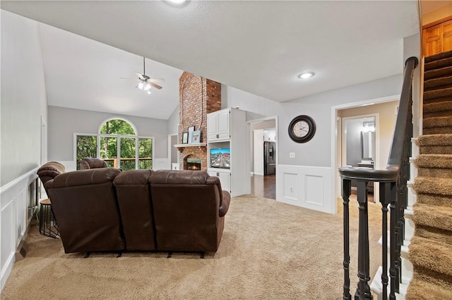 414 N 4th St, Gower, MO 64454 - living room with a decorative wall, light colored carpet, ceiling fan, wainscoting, and stairs