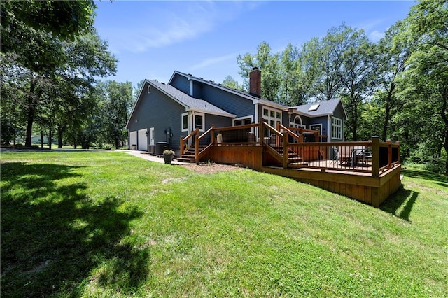 414 N 4th St, Gower, MO 64454 - rear view of house with a wooden deck, a chimney, and a lawn