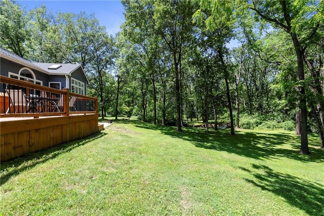 414 N 4th St, Gower, MO 64454 - view of green lawn with a wooden deck