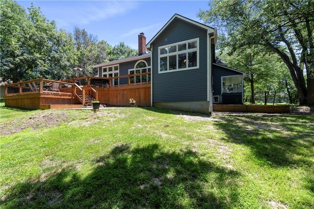 414 N 4th St, Gower, MO 64454 - back of property featuring a yard, a chimney, and a deck